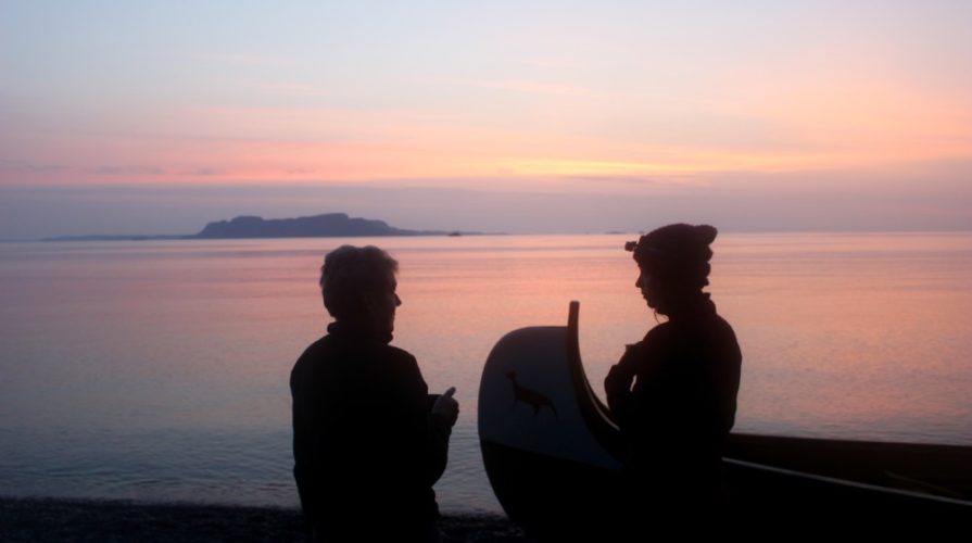 voyageur canoe at sunset