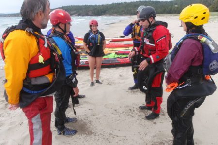 Sea kayak surf lesson beach talk at Naturally Superior Adventures