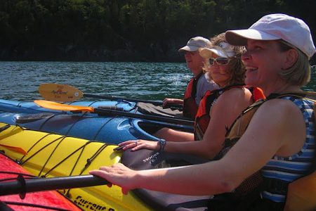 Family in sea kayaks in a lesson at Naturally Superior Adventures