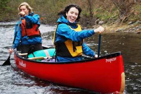 Two ladies in a canoe at Naturally Superior Adventures