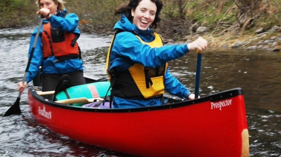 Two ladies in a canoe at Naturally Superior Adventures